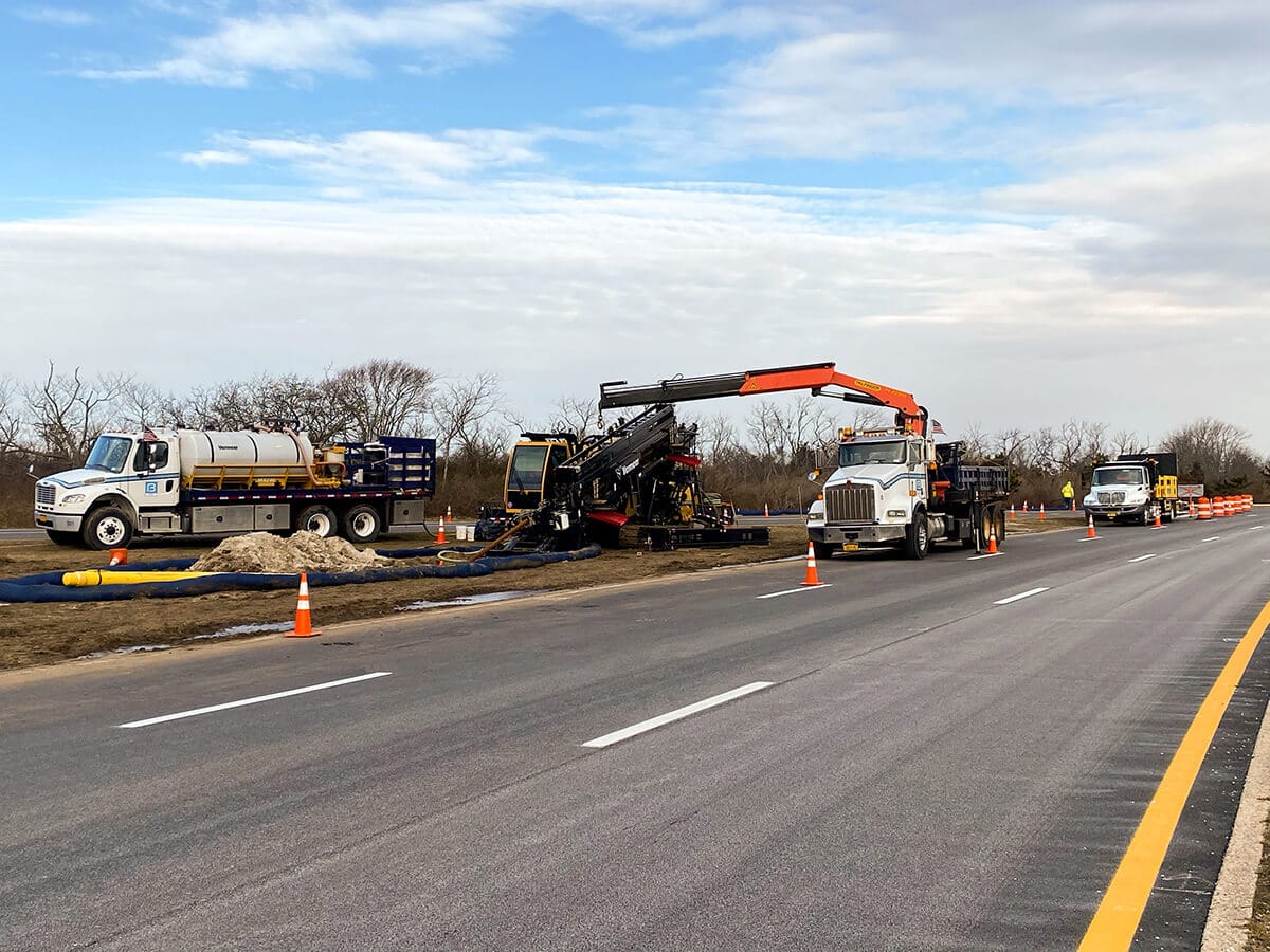 Bancker crew performing horizontal directional drilling utility installation along a New York roadway