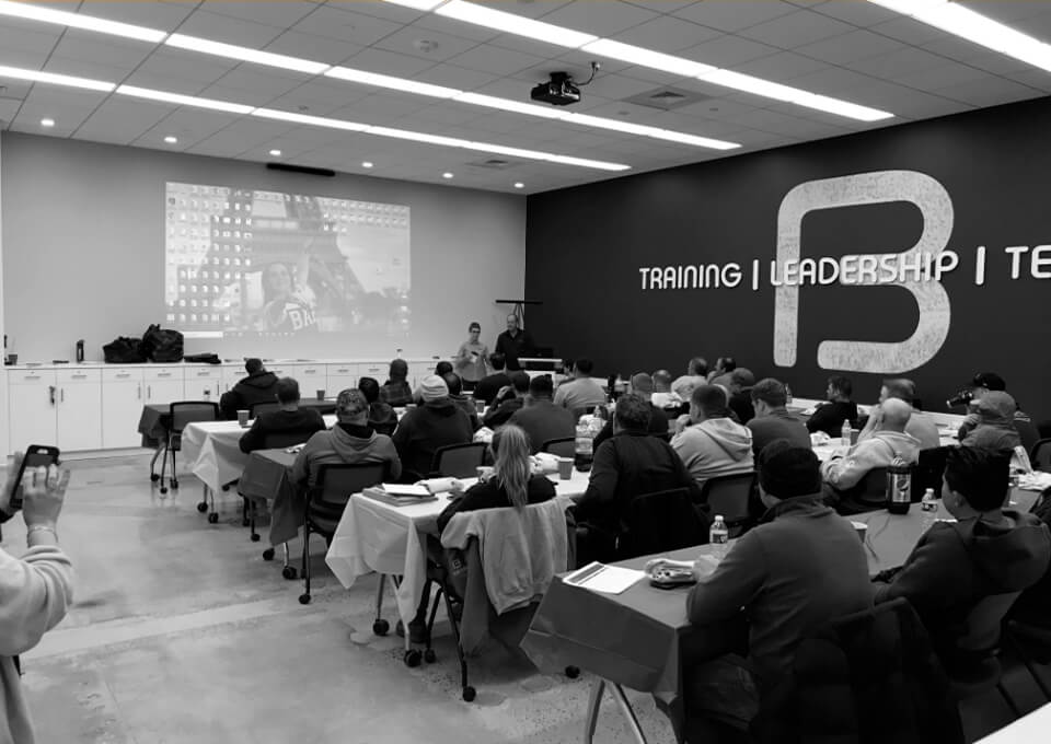 Bancker employee training session in a corporate training room